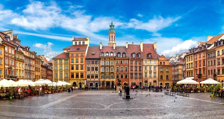 Colorful historical square with tall buildings and vibrant atmosphere.
