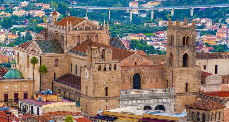 Historic cathedral building overlooking city rooftops.