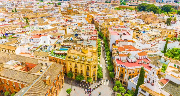 Aerial view of a colorful city with historic buildings.