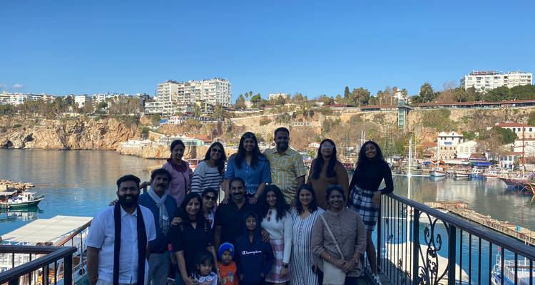 Group photo with a scenic coastal background.