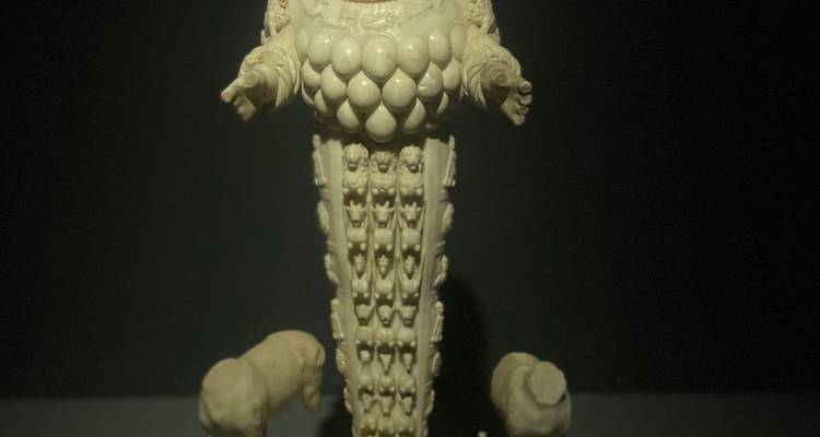 Ancient sculpture in a museum setting.