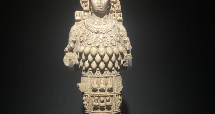 Statue of a female deity with intricate details and ornate decorations.