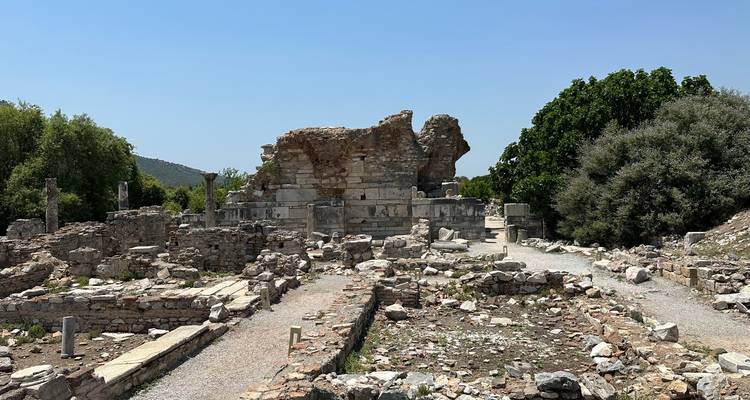 Ancient ruins with stone structures and rubble.
