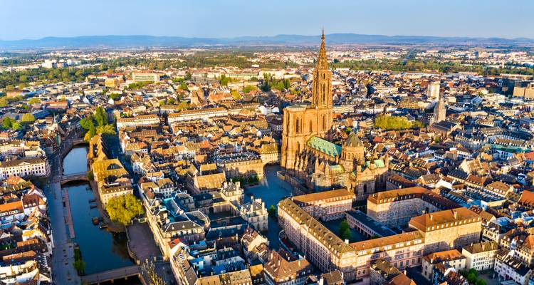 Drone view of Strasbourg with its iconic cathedral towering above the medieval grid