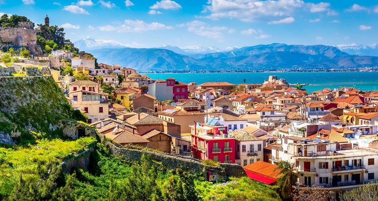 Nafplion cityscape with colorful homes and mountains in the distance.