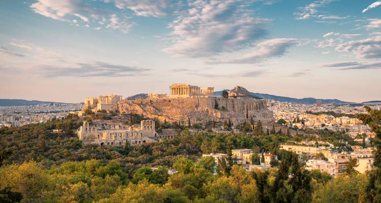 View of the Acropolis in Athens with a cityscape in the background.