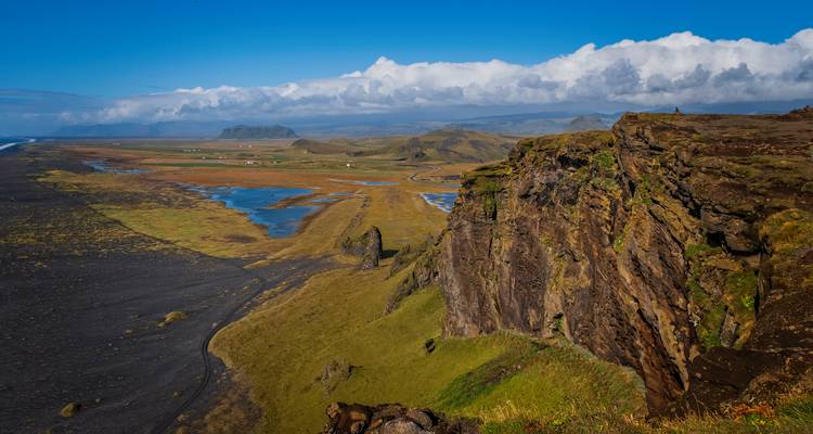 Cliffside and black sand beach landscape near Vik.