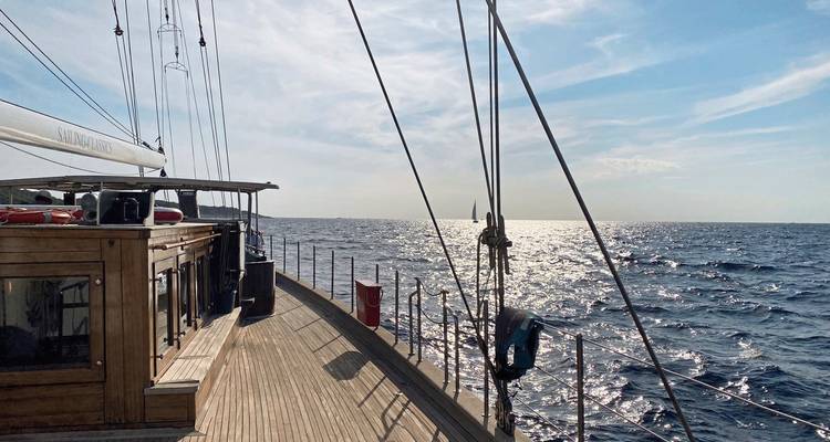 View of ocean from a sailboat deck at sea.