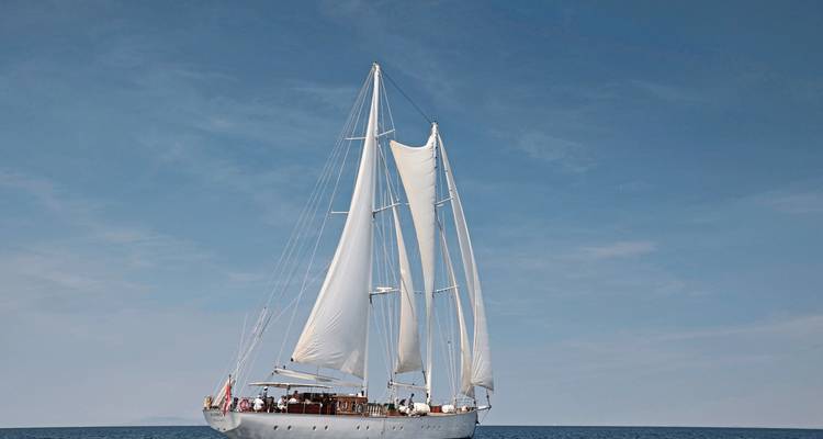 Large white sailboat on the open sea.