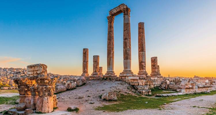 Ancient Roman columns at sunset in Amman, Jordan.