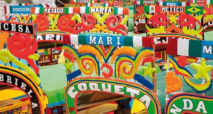 Colorful boats known as 'trajineras' used for Xochimilco canals.