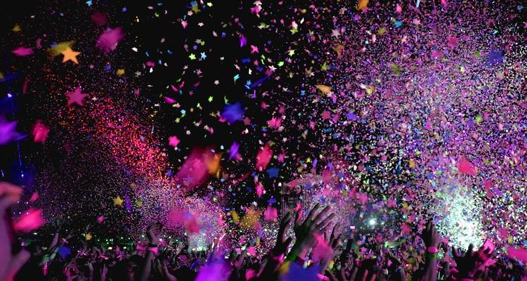 Vibrant confetti and lights at a nighttime event.