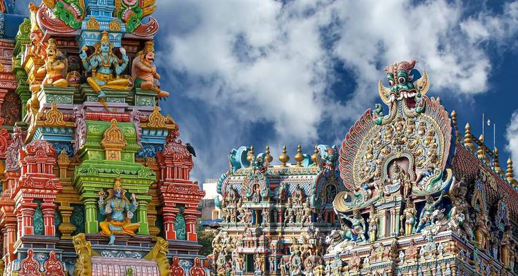 Ornate and colorful Hindu temple façade with detailed carvings.