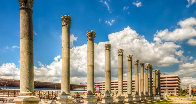 Row of ancient columns under a bright sky.