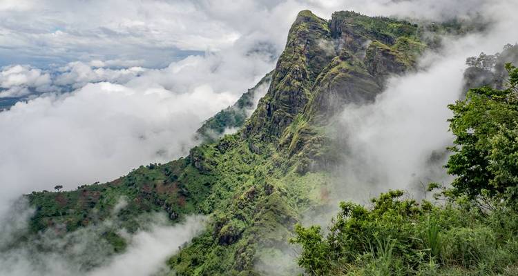 Mountainous landscape covered in clouds.