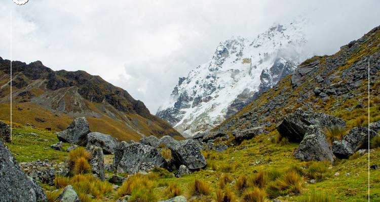 Mountainous landscape with snow and rock formations.