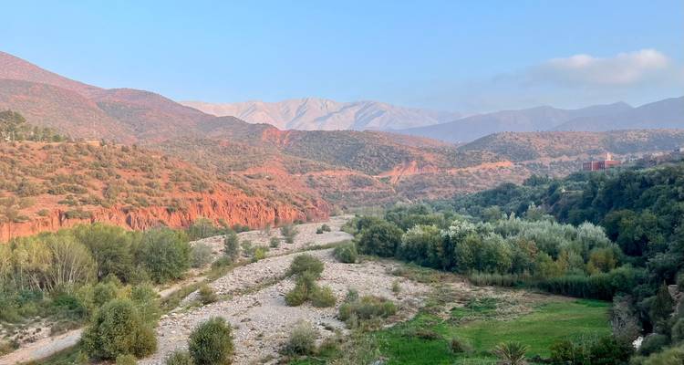 Scenic view of a river winding through a lush green valley.