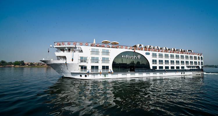 Cruise ship on a river in a sunny day.