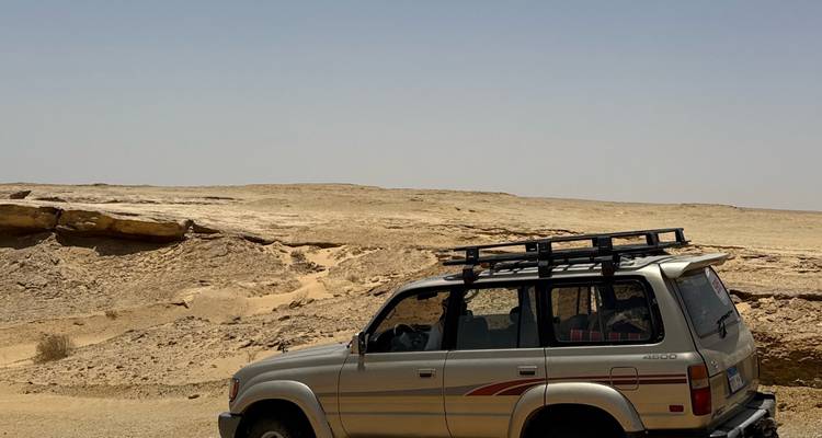 4x4 vehicle parked in a desert setting.