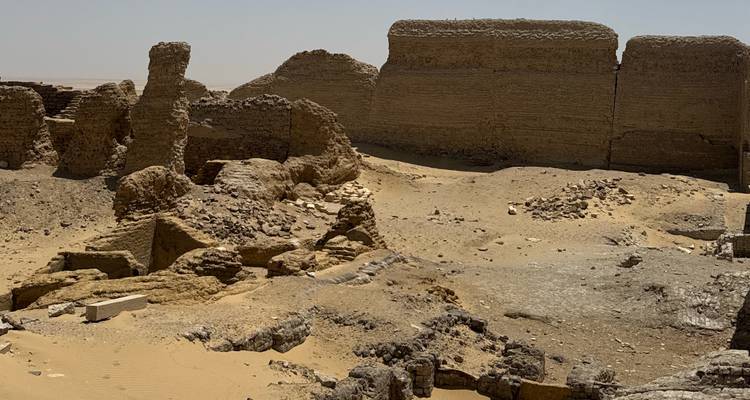 Sandy desert with rocky formations