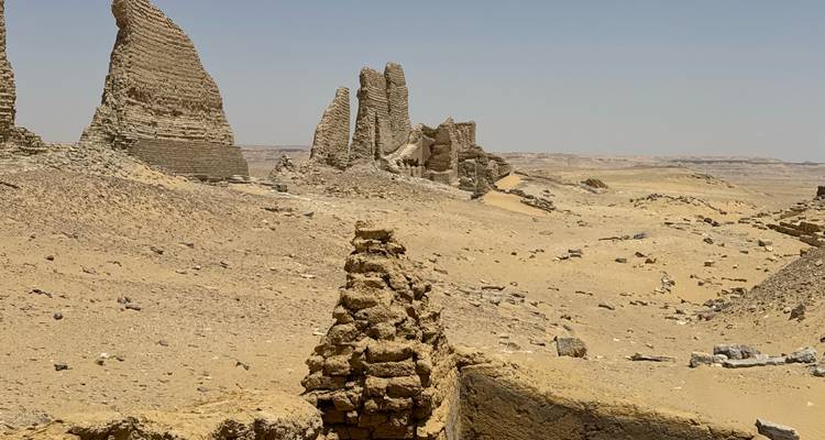 Stone ruins in a vast desert landscape