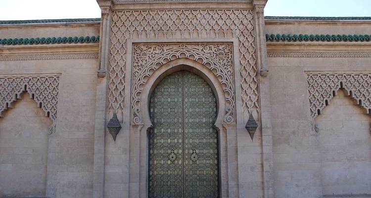 Ornate wooden and stone entrance gate.