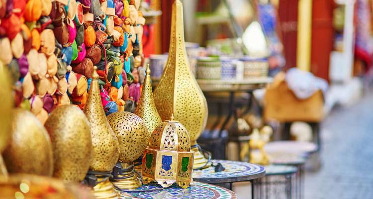 A bustling market with vibrant lanterns and crafts on display.