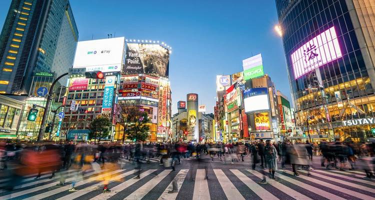 Busy Shibuya Crossing in Tokyo at night.