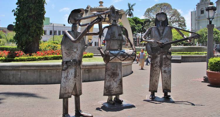 Metal sculptures of musicians in a city park.