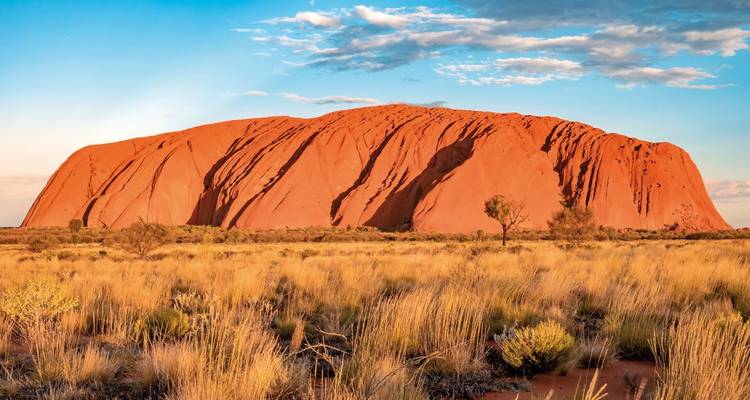 Famous red rock formation in a desert landscape.