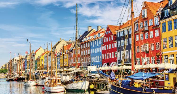 Nyhavn canal with colorful buildings and boats in Copenhagen.