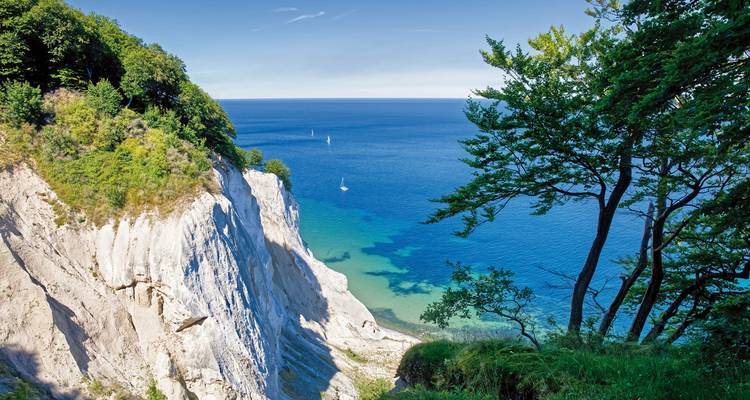 Cliffs overlooking clear blue sea at Møns Klint.
