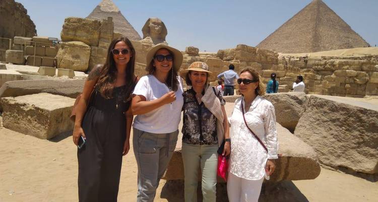 Four women posing at the Pyramids of Giza