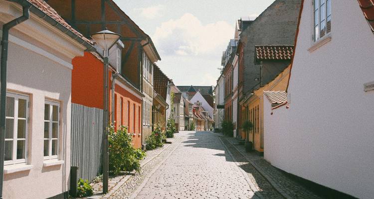 Charming street with colorful old buildings in a European town.