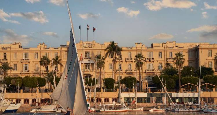Sailboat passing in front of the Winter Palace hotel in Luxor.