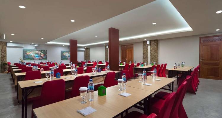 Conference room set up with tables and chairs.