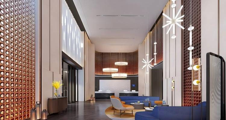 Stijlvolle hotellobby met moderne verlichting en zithoek.