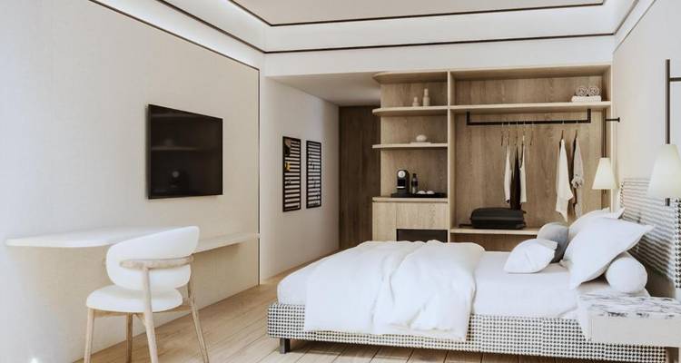 Habitación de hotel contemporánea con decoración minimalista y una cama cómoda.
