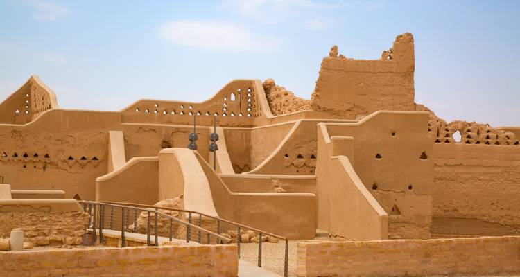 Ancient mudbrick building with decorative elements.