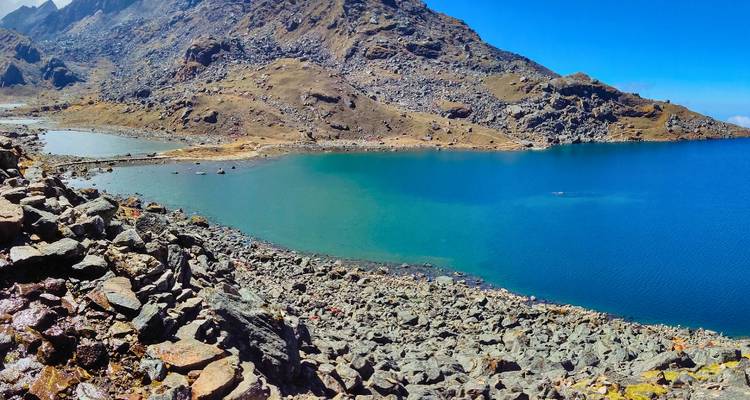 Clear lake nestled within a mountainous landscape.