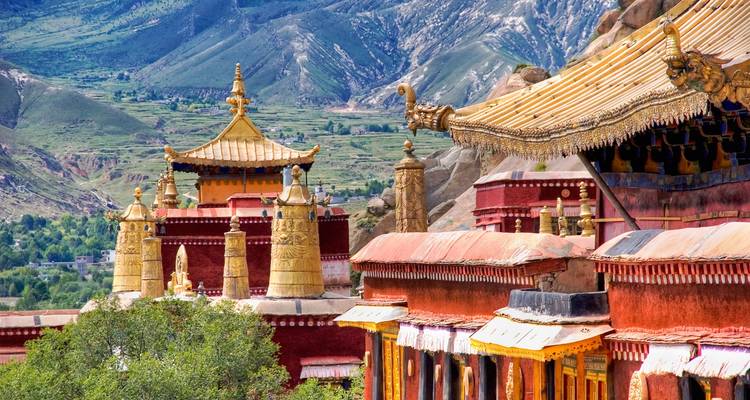Tibetan-style temple in a mountainous landscape.