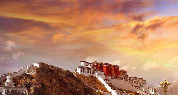 View of Potala Palace on a hill during sunset.