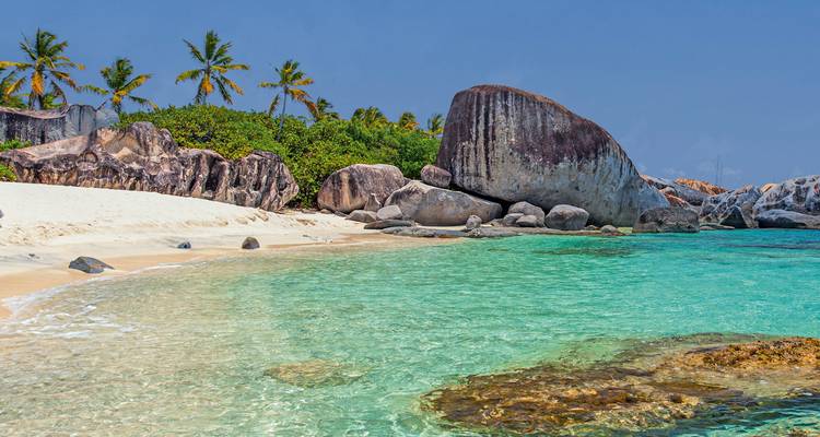 Scenic beach with crystal clear waters and unique rock formations.