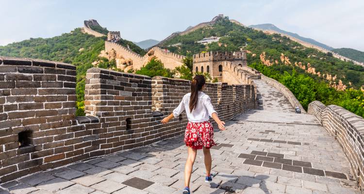 Woman walking on the Great Wall of China.