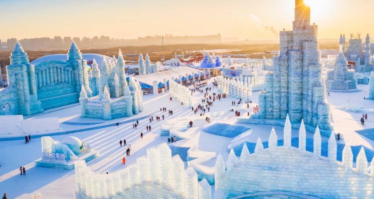 Ice sculpture festival with various ice structures.