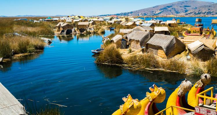 Floating reed islands with traditional boats on Lake Titicaca.