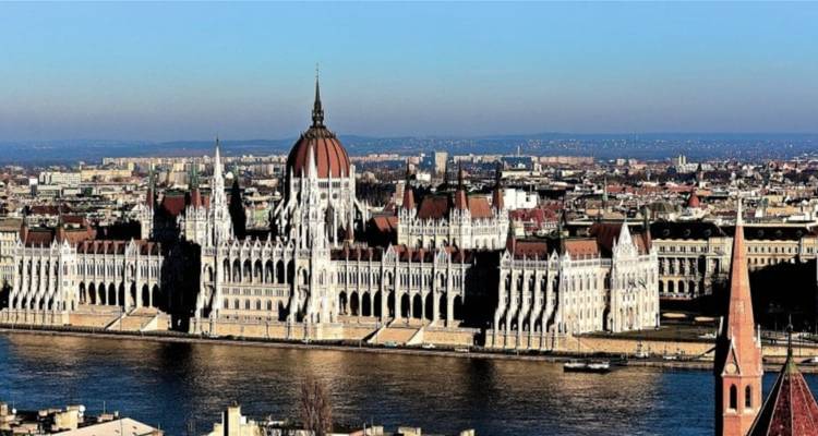 Hungarian Parliament Building with river view on a sunny day.