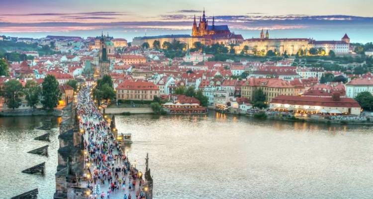 Charles Bridge in Prague with the Prague Castle in the background.