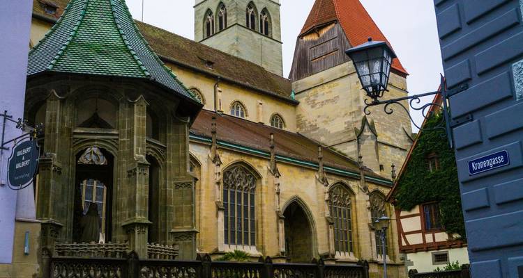 A church in a historic town with diverse architectural styles.