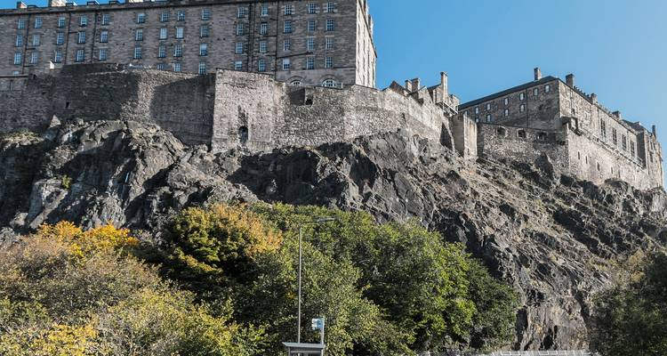 View of large castle structures on a rocky hill